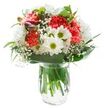 Radiating warmth and optimism, this expertly designed bouquet makes a striking focal point in its crystal-clear glass vase, glowing against a snow-white background. Coral-pink carnations form a lively nucleus, their crimped petals full of energy and flair, echoed by crisp white chrysanthemums layered in dense clusters, much like the timeless florals seen in Earlsfield's bustling local markets. Small white daisies with prominent yellow-green centres dot the arrangement, adding sparks of brightness and imbuing the bouquet with a spirit of cheerful simplicity. Feathery sprays of baby's breath float among the larger blooms, softening the profile with gentle delicacy. A hint of magenta from closed alstroemeria buds adds a whisper of intrigue along one side. The lush, leafy collar-broad, glossy, and deeply green-grounds the bouquet and frames the blossoms, reminiscent of the mature trees lining Waynflete Street. Slender greens intersperse throughout, enhancing the natural, garden-fresh look. Inside the transparent vase, vibrant stems are submerged in clear water, highlighting the skilled, freshly gathered craft. Bright, even lighting ensures the colours sing and textures stand out, each detail harmoniously balanced. This bouquet's thoughtful blend of hues and forms makes it a heartfelt gift for opening new chapters, celebrating birthdays, or adding gentle beauty to a sunny windowsill or a breakfast table in the heart of Earlsfield.